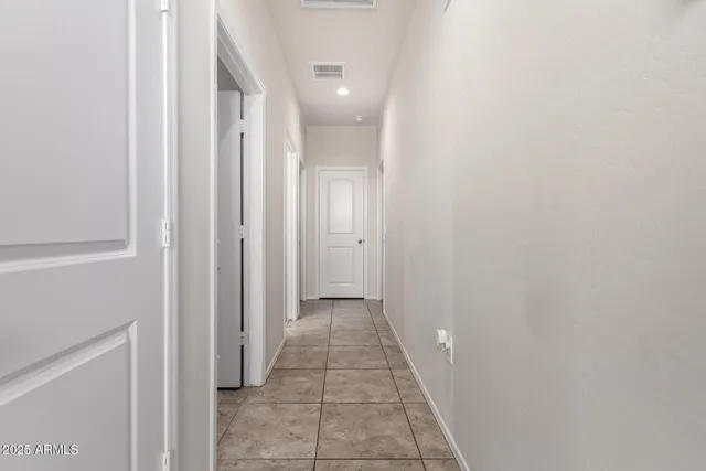 a view of a hallway with a white walls
