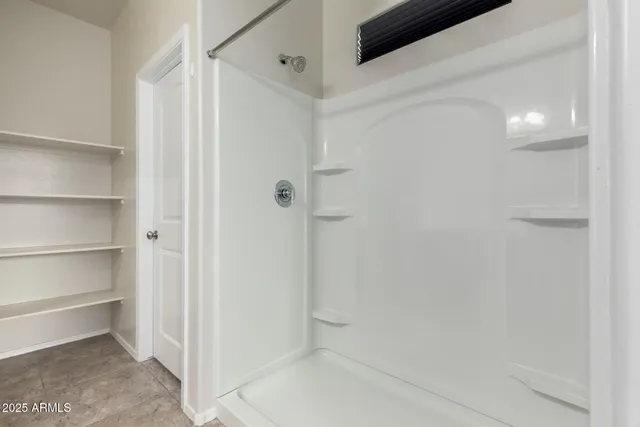 a view of an empty walk in closet