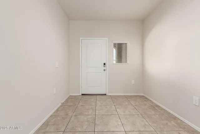 an empty room with a bench