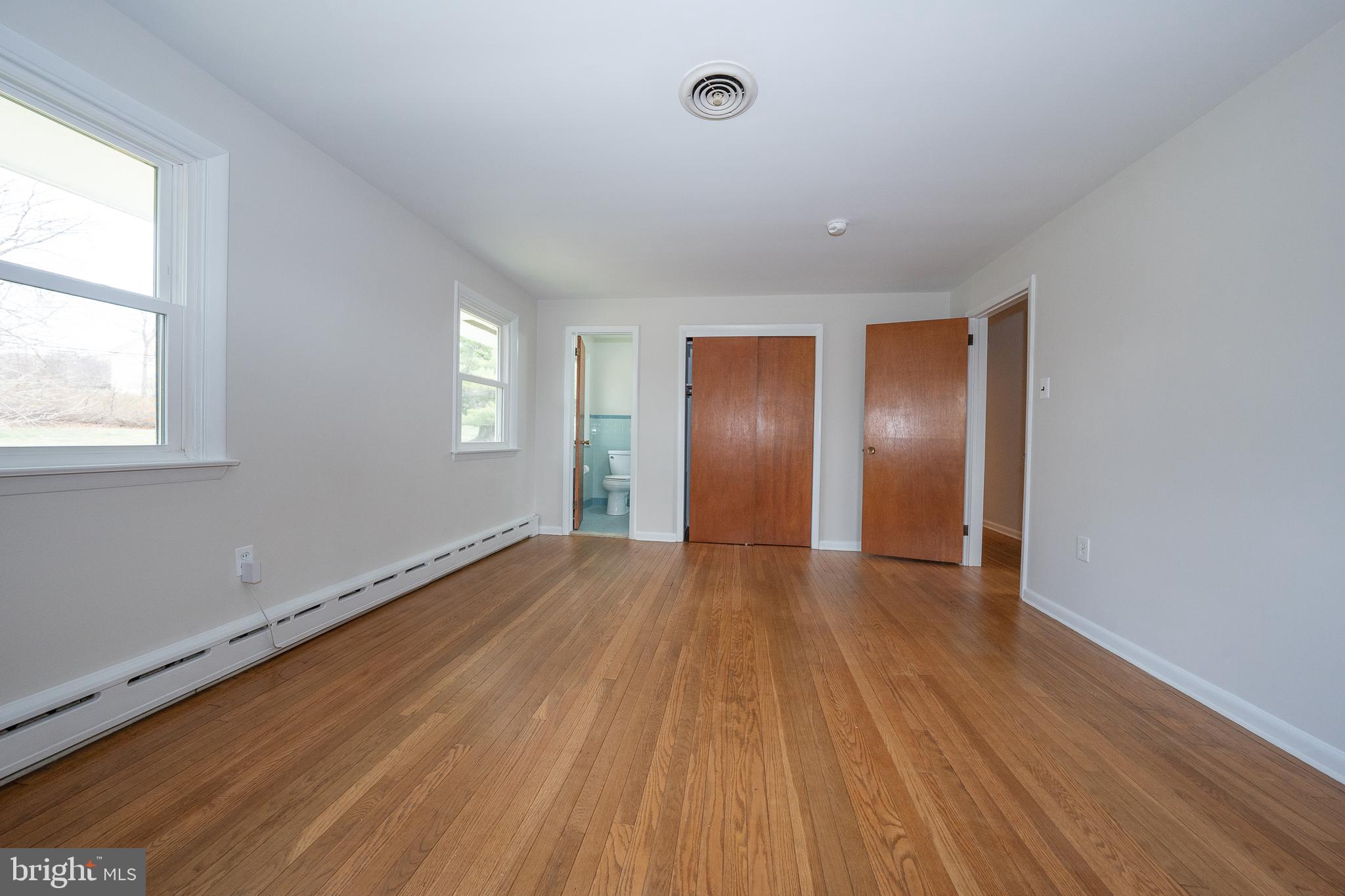 1435 North Trooper Road Methacton, PA 19403 - Photo 14 of 30 an empty room with wooden floor and windows