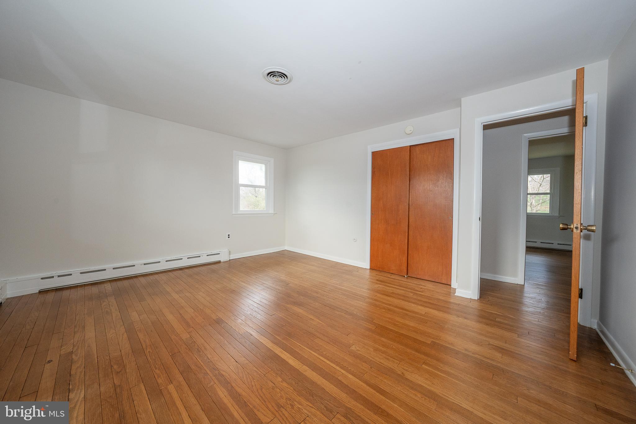 1435 North Trooper Road Methacton, PA 19403 - Photo 16 of 30 an empty room with wooden floor and windows