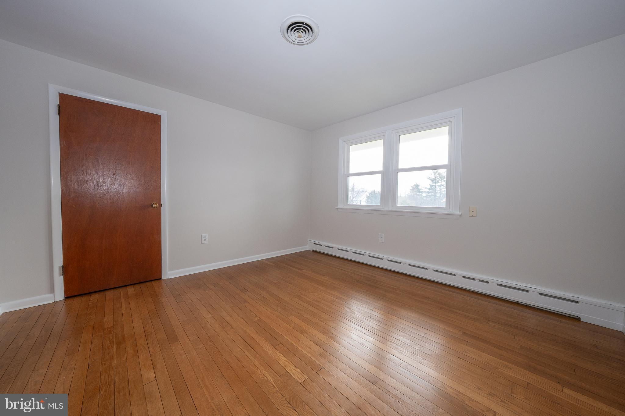 1435 North Trooper Road Methacton, PA 19403 - Photo 17 of 30 an empty room with wooden floor and windows