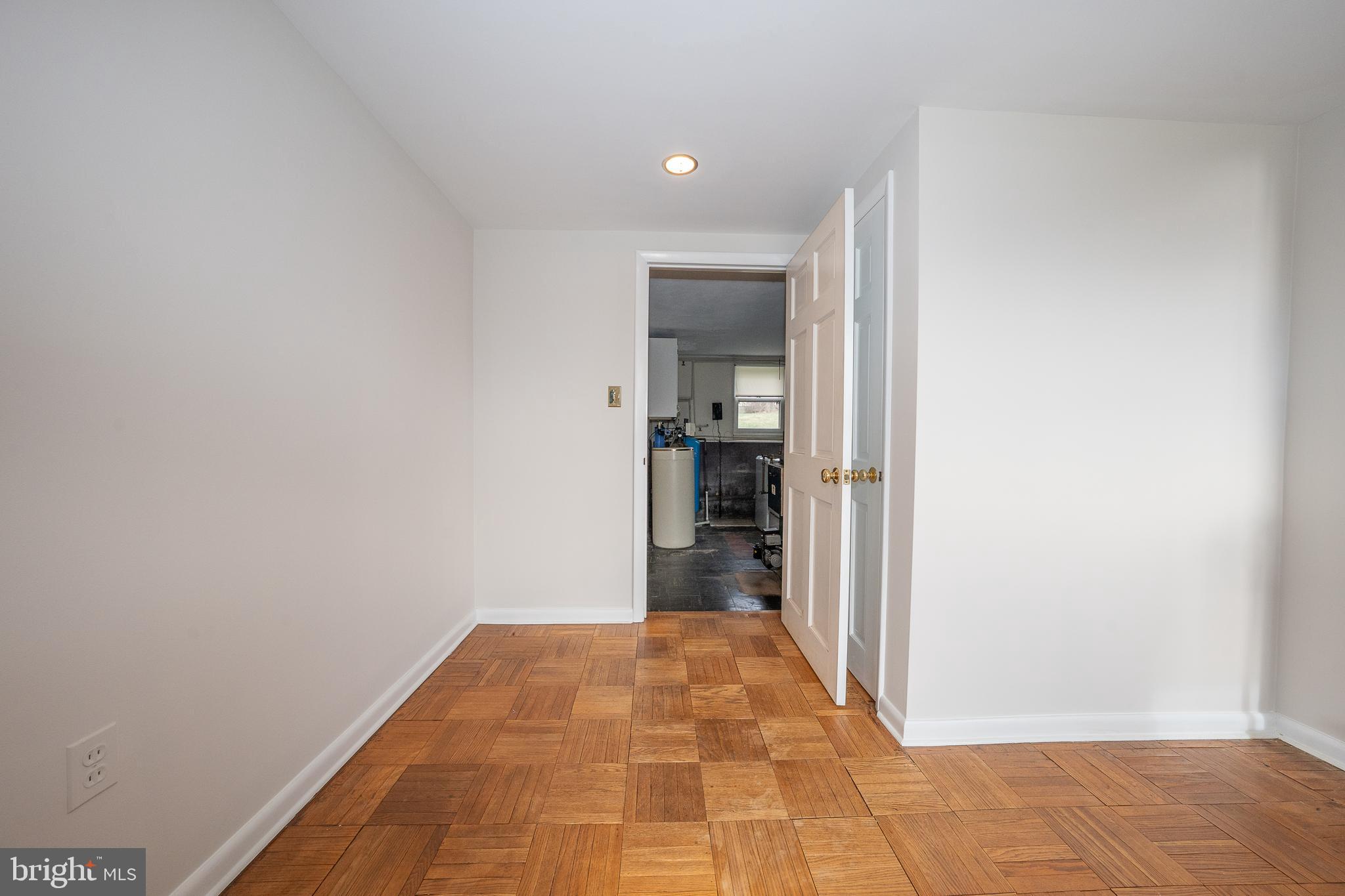 1435 North Trooper Road Methacton, PA 19403 - Photo 24 of 30 a view of a hallway with wooden floor and a bathroom