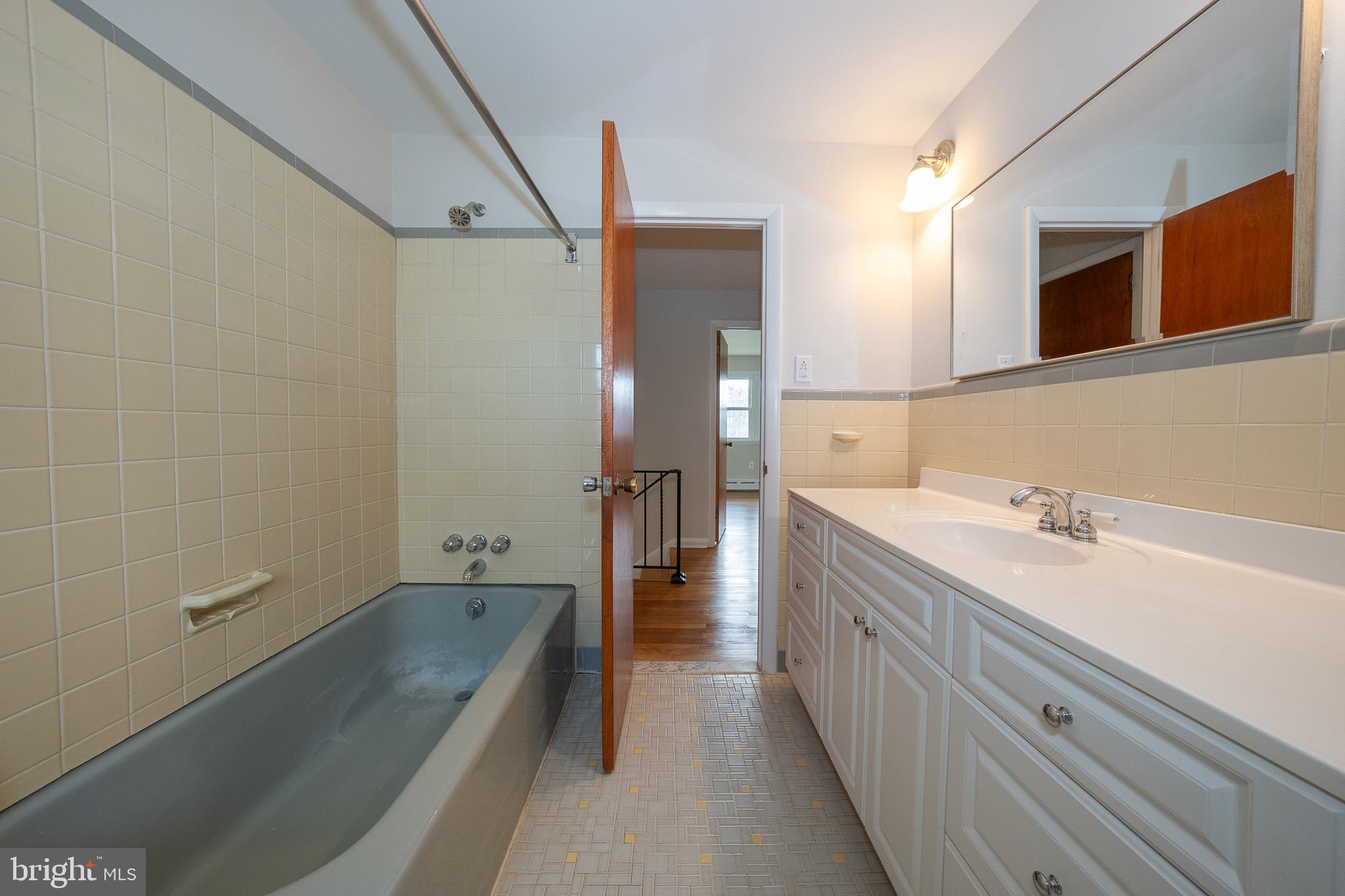1435 North Trooper Road Methacton, PA 19403 - Photo 27 of 30 a spacious bathroom with a tub sink and mirror