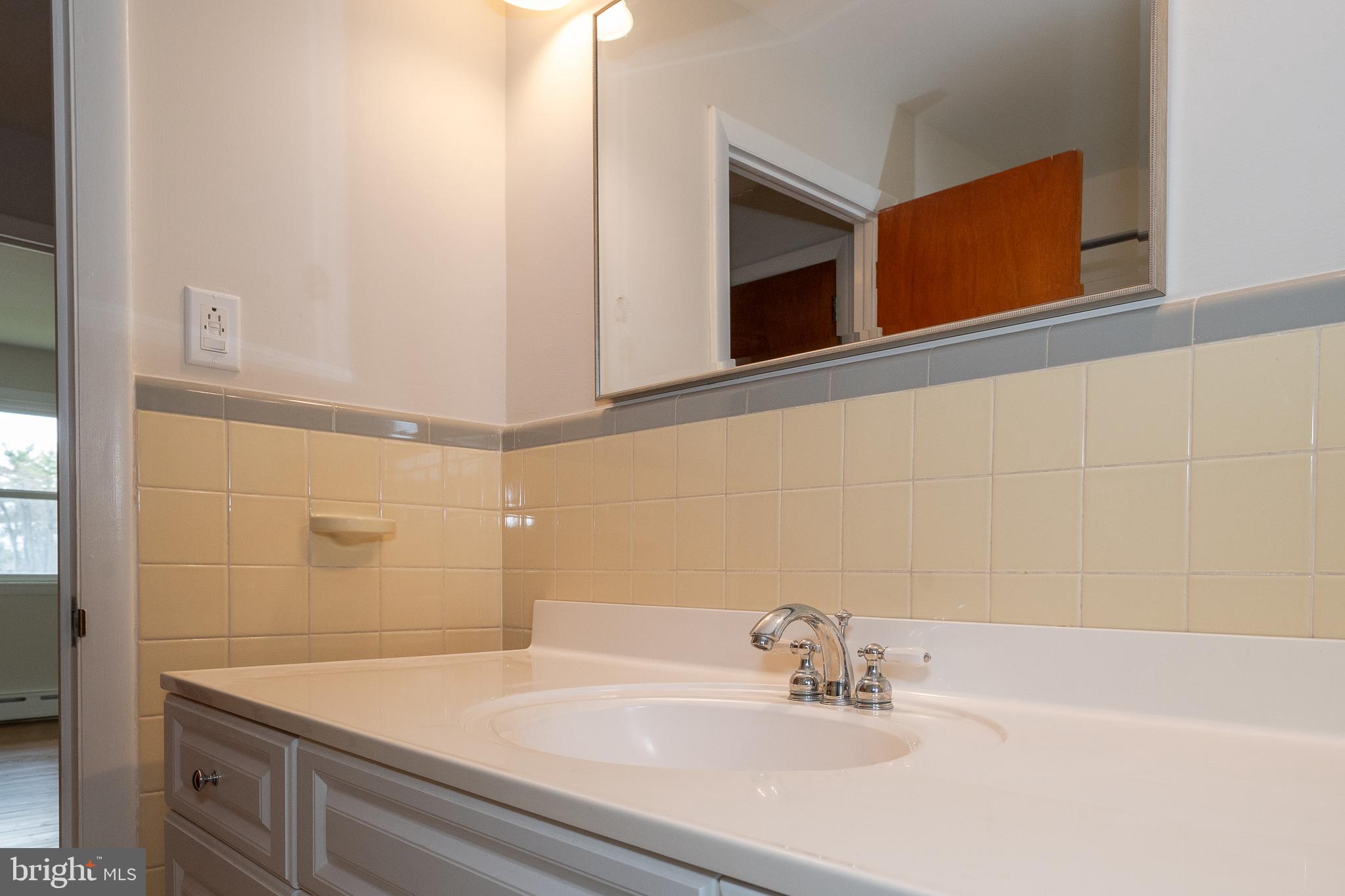 1435 North Trooper Road Methacton, PA 19403 - Photo 28 of 30 a bathroom with a sink and a mirror