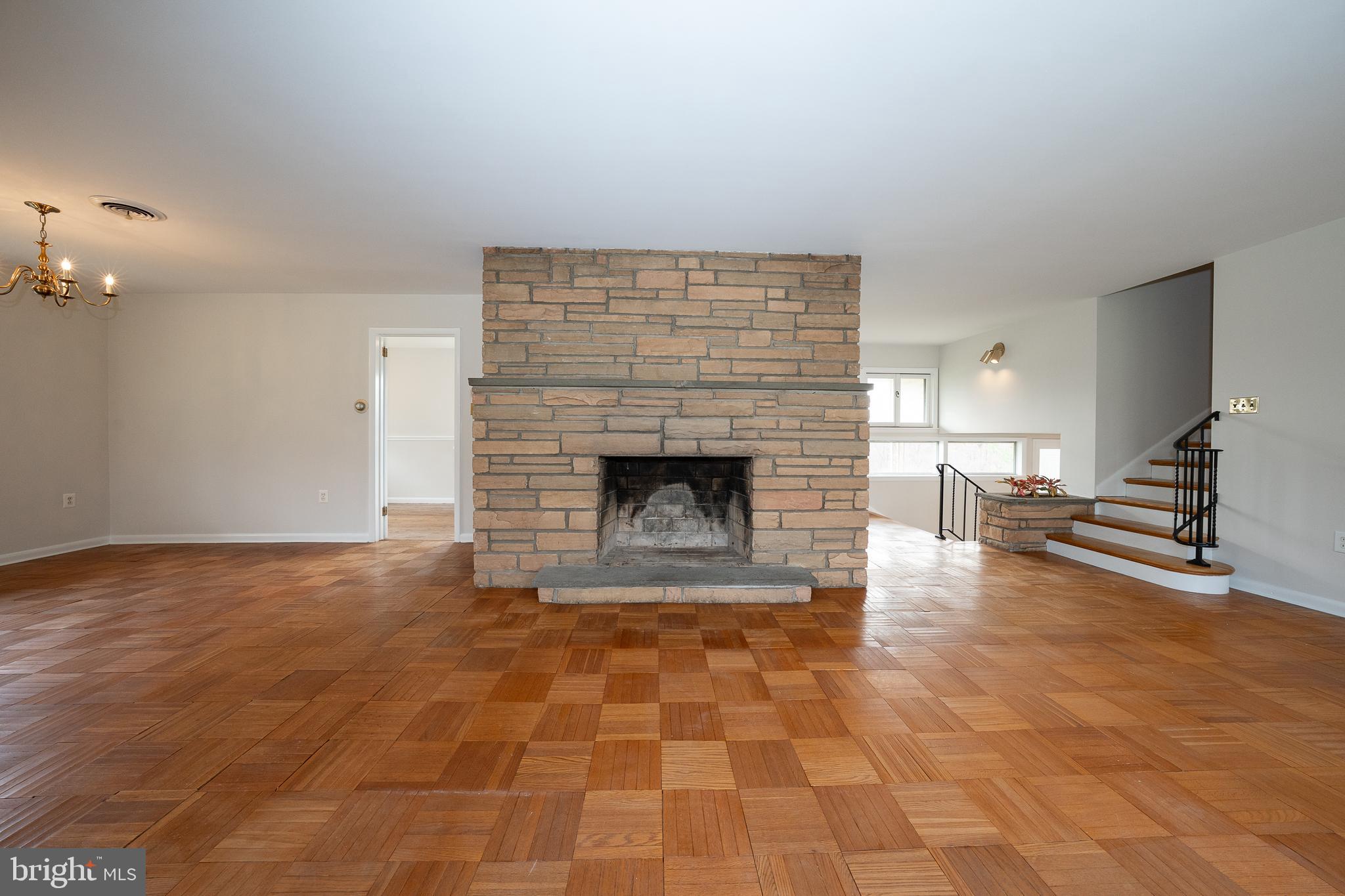 1435 North Trooper Road Methacton, PA 19403 - Photo 10 of 30 a view of empty room with wooden floor and fireplace