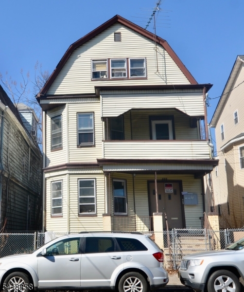 a front view of a house with parking space
