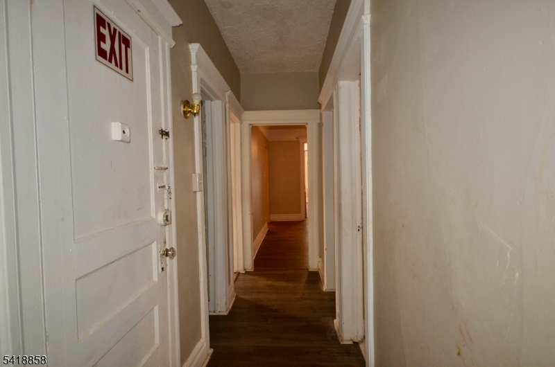 899 South 18th Street, Unit 1 Newark, NJ 07108 - Photo 12 of 23 a view of a hallway with wooden floor