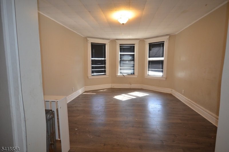 899 South 18th Street, Unit 1 Newark, NJ 07108 - Photo 4 of 23 a view of empty room with windows