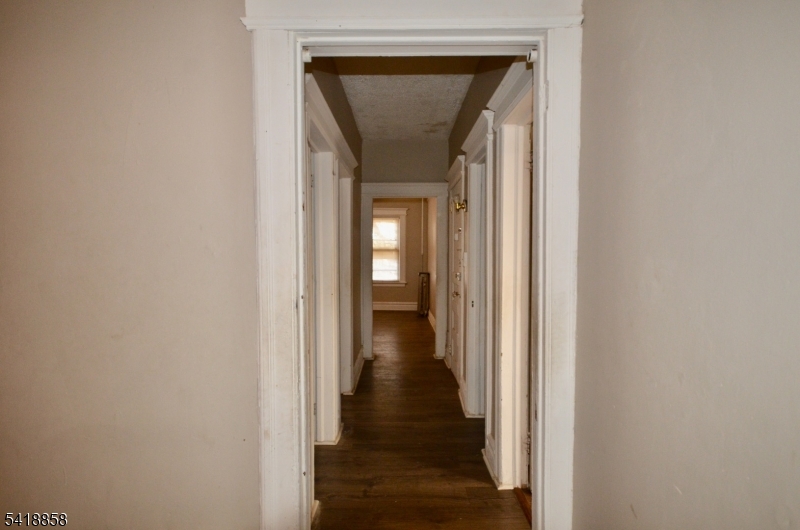 899 South 18th Street, Unit 1 Newark, NJ 07108 - Photo 7 of 23 a view of a hallway with wooden floor and a hallway
