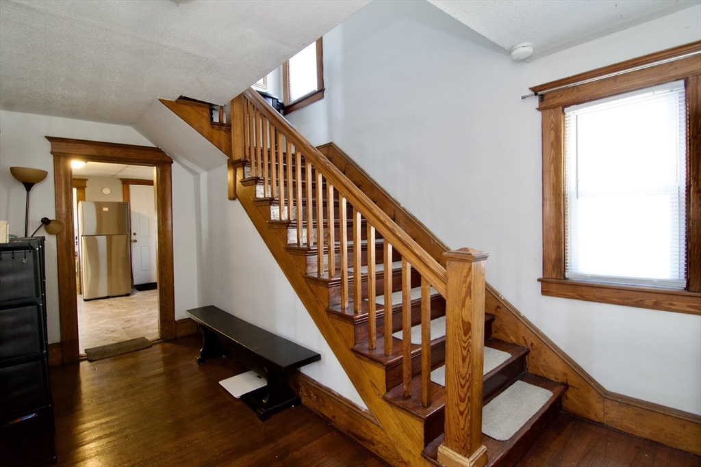16 Amity Court Springfield, MA 01108 - Photo 5 of 42 a view of entryway with wooden floor and stairs