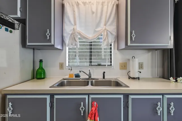 a kitchen with a sink and a window