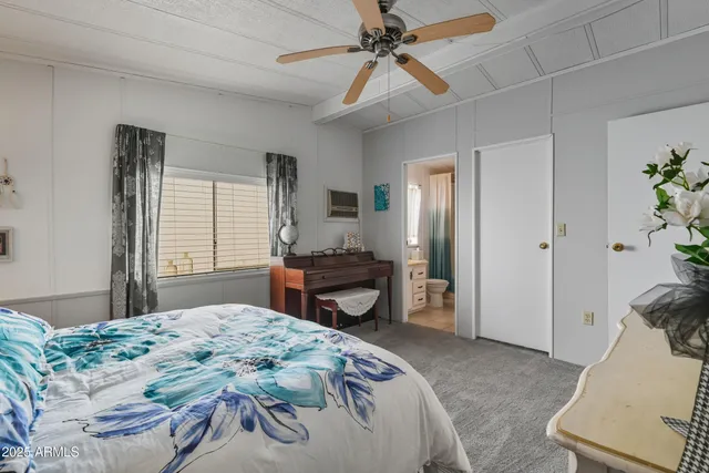 a bedroom with a bed and a dresser