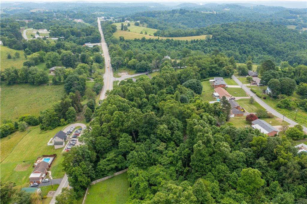 0 Route 40 Fredericktown, PA 15333 - Photo 15 of 16 an aerial view of a house with a yard and lake view