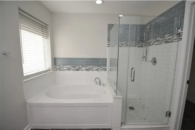 a white bath tub sitting next to a window