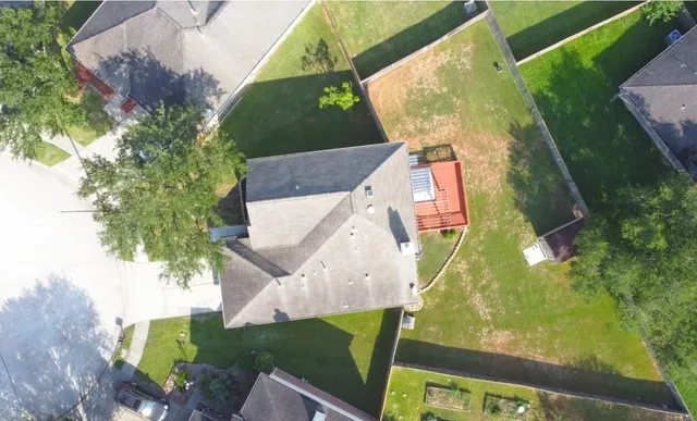 an aerial view of a house with swimming pool