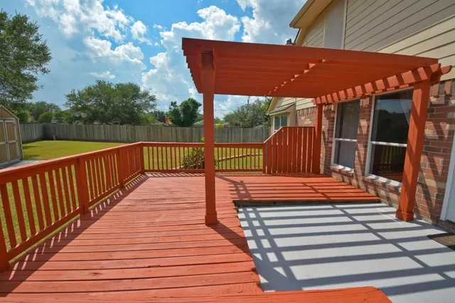 a view of a wooden deck with a bench