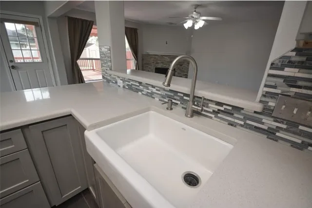 a bathroom with a sink a mirror and vanity