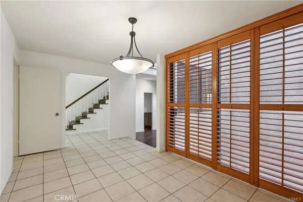 a kitchen with granite countertop cabinets stainless steel appliances and a counter space