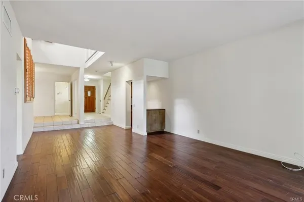 a kitchen with stainless steel appliances granite countertop a sink a stove top oven and cabinets