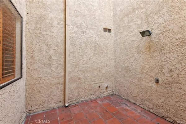 a view of a house with garden and trees