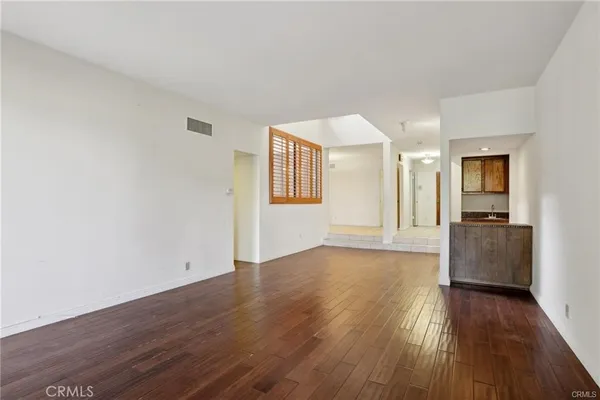 a kitchen with granite countertop cabinets stainless steel appliances and a counter space