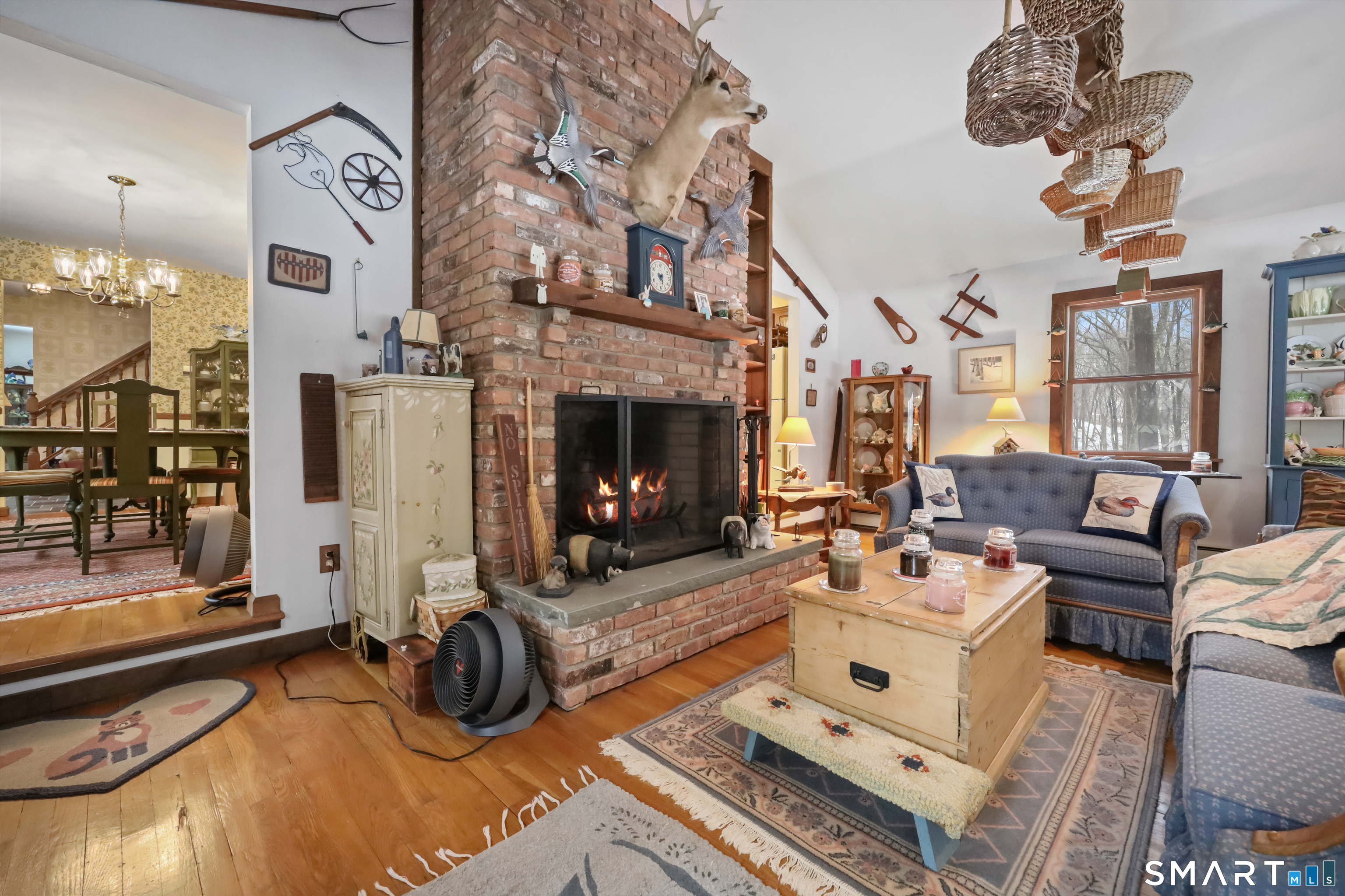 429 Rock House Road Redding, CT 06896 - Photo 13 of 26 a living room with furniture a fireplace and decor