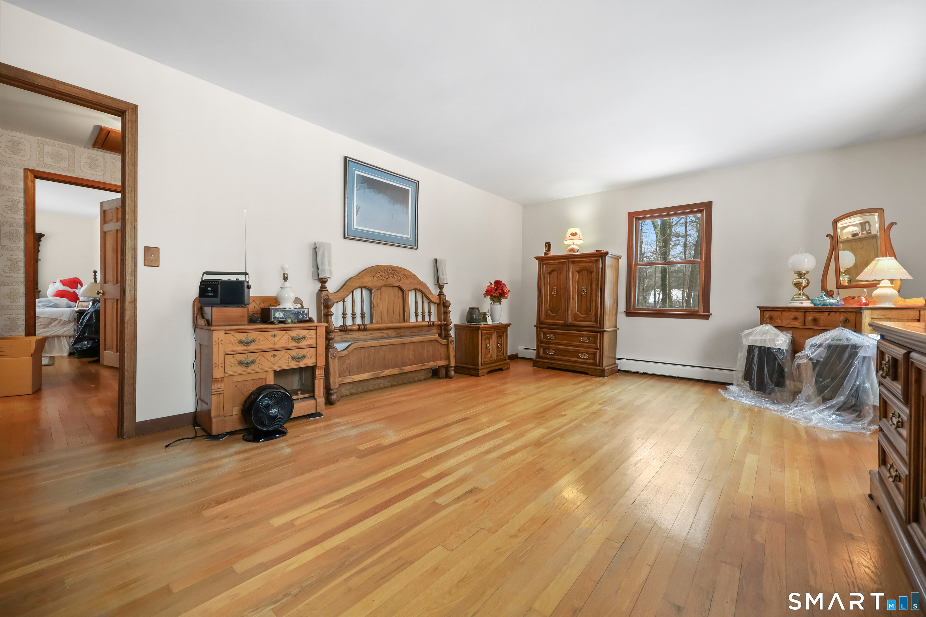 429 Rock House Road Redding, CT 06896 - Photo 16 of 26 a view of a livingroom with furniture & a ceiling fan