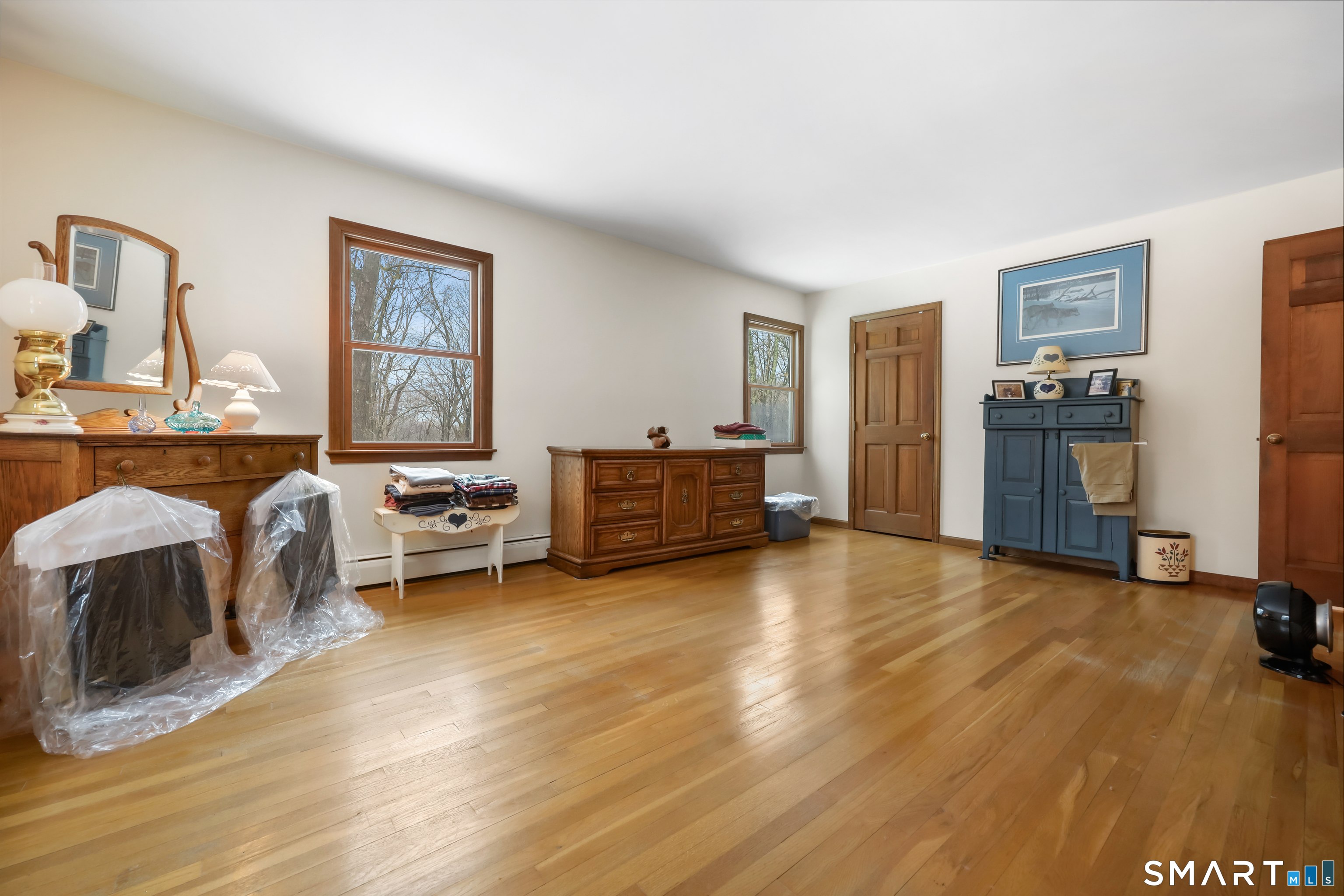 429 Rock House Road Redding, CT 06896 - Photo 17 of 26 a view of a livingroom with furniture and windows