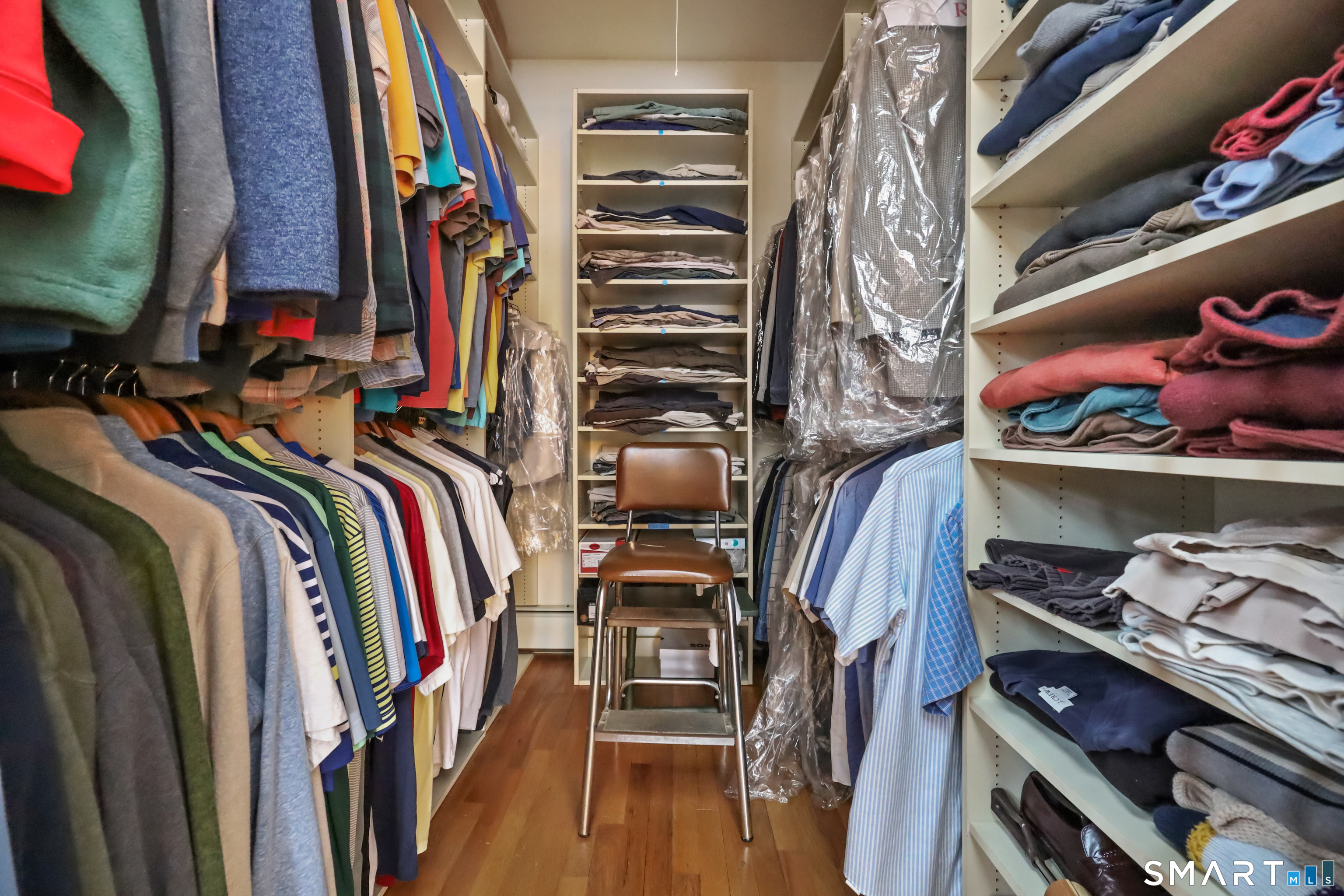 429 Rock House Road Redding, CT 06896 - Photo 18 of 26 a view of walk in closet with clothes and shoes