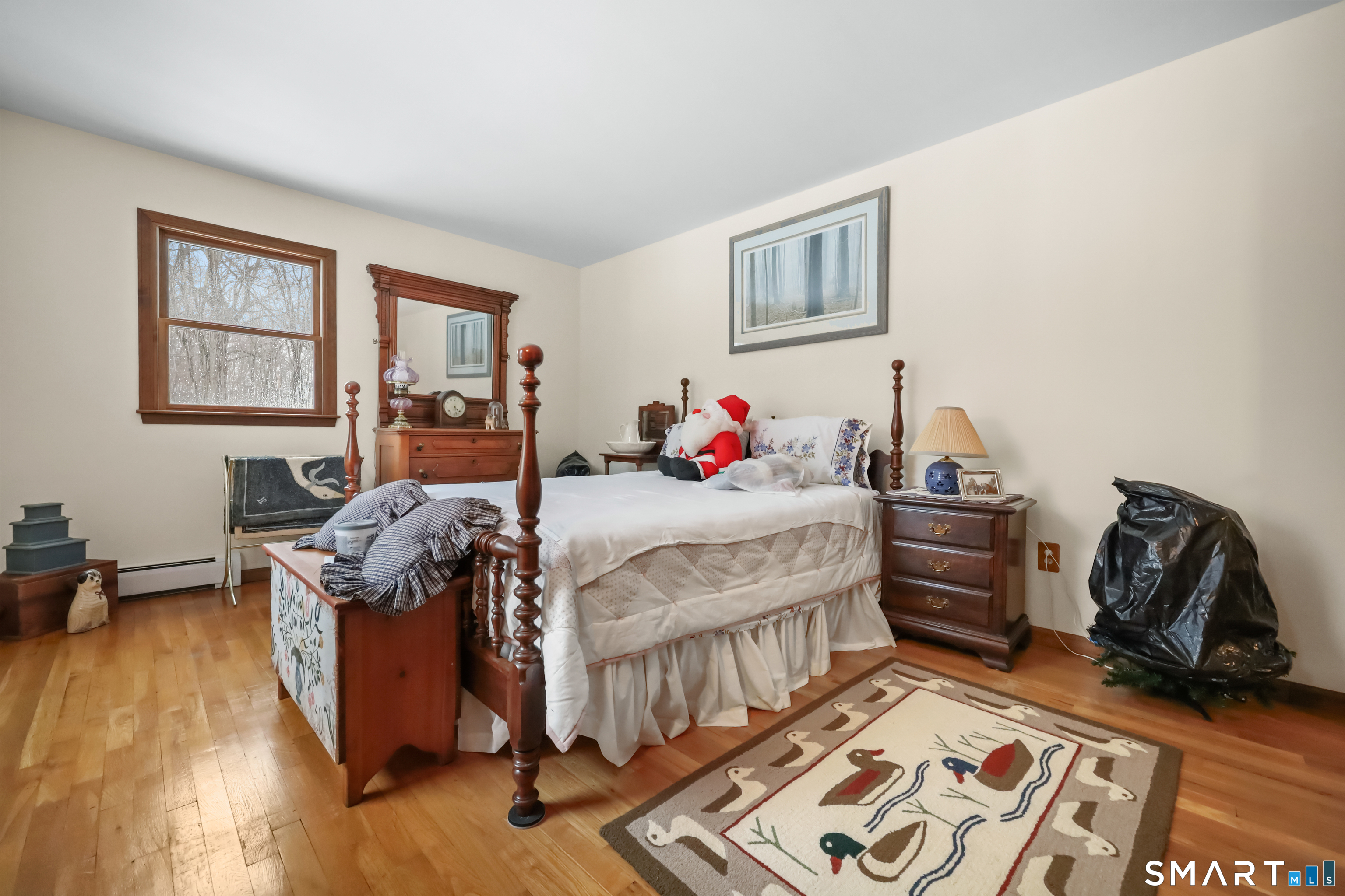 429 Rock House Road Redding, CT 06896 - Photo 21 of 26 a bed room with a bed and a chair