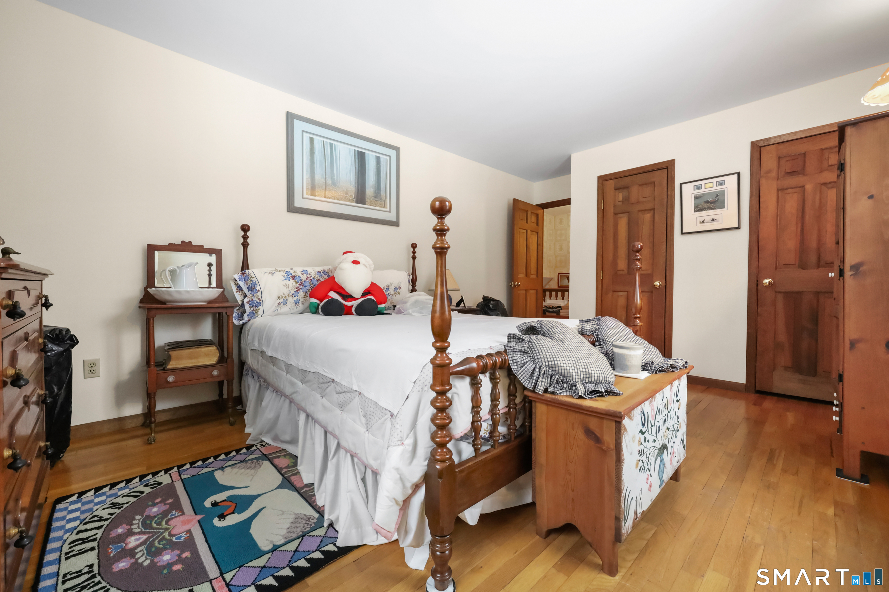 429 Rock House Road Redding, CT 06896 - Photo 22 of 26 a bed room with a bed and a chair