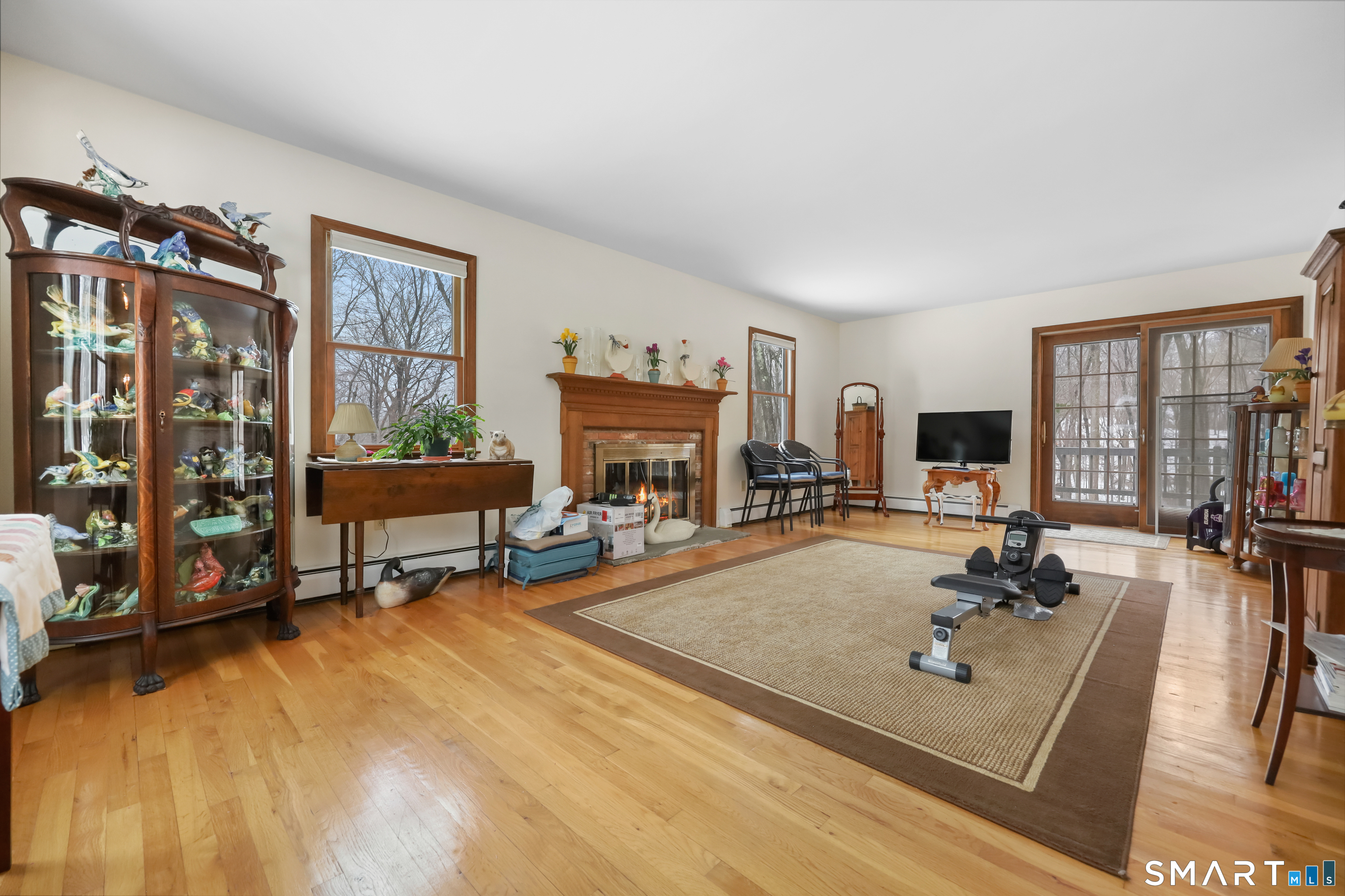 429 Rock House Road Redding, CT 06896 - Photo 3 of 26 a living room with furniture and a fireplace