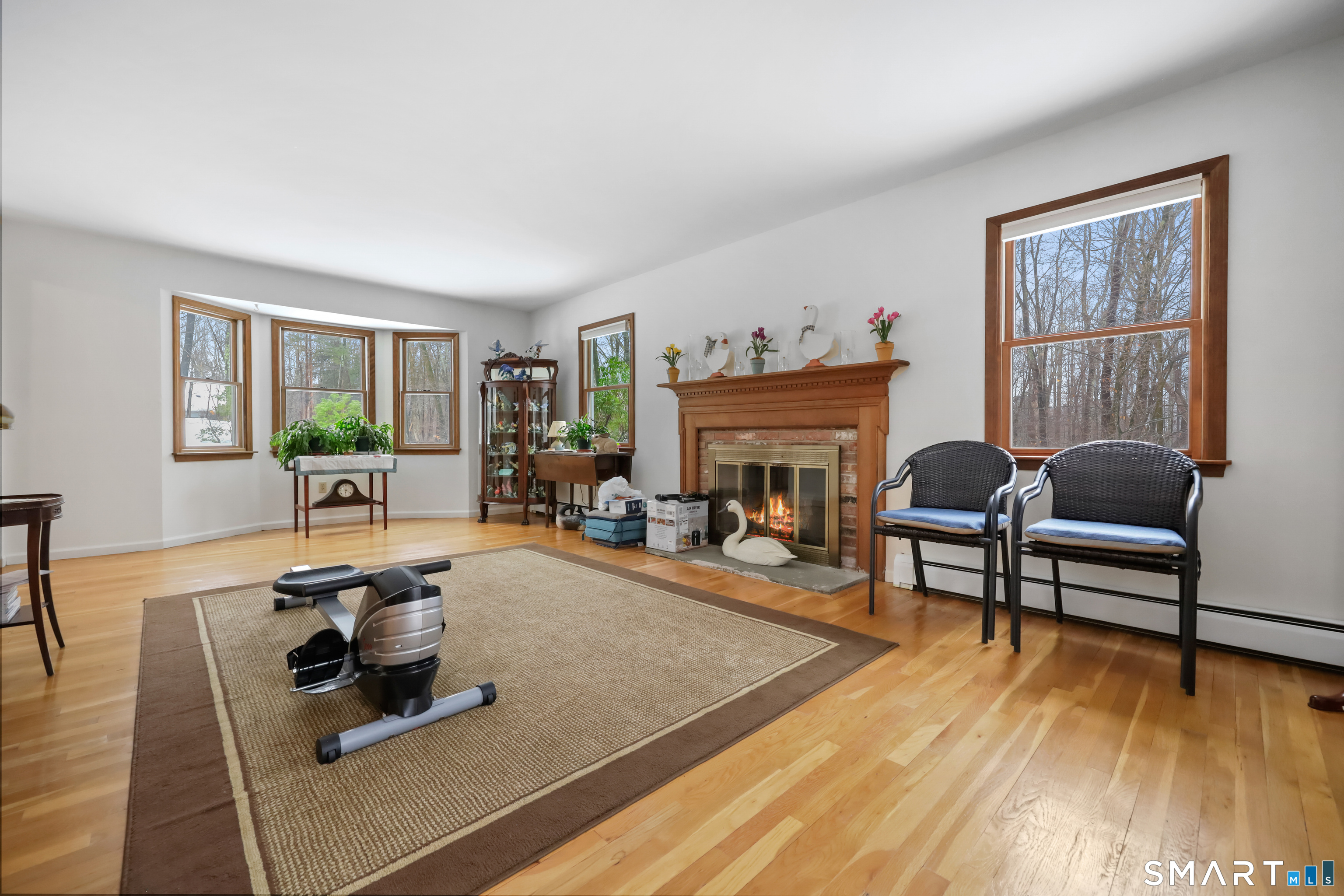 429 Rock House Road Redding, CT 06896 - Photo 4 of 26 a living room with furniture and a fireplace