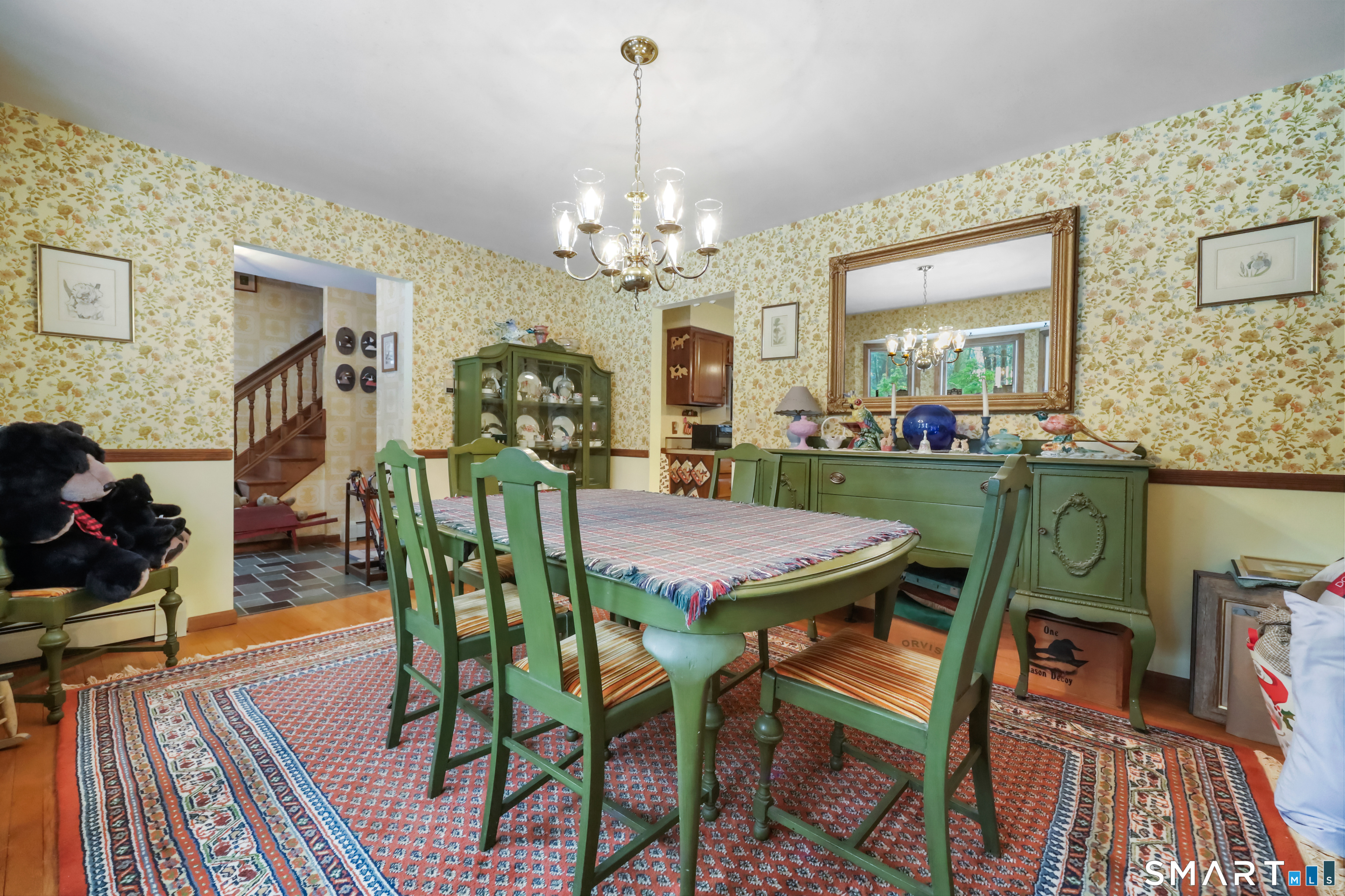 429 Rock House Road Redding, CT 06896 - Photo 5 of 26 a view of a dining room with furniture and wooden floor
