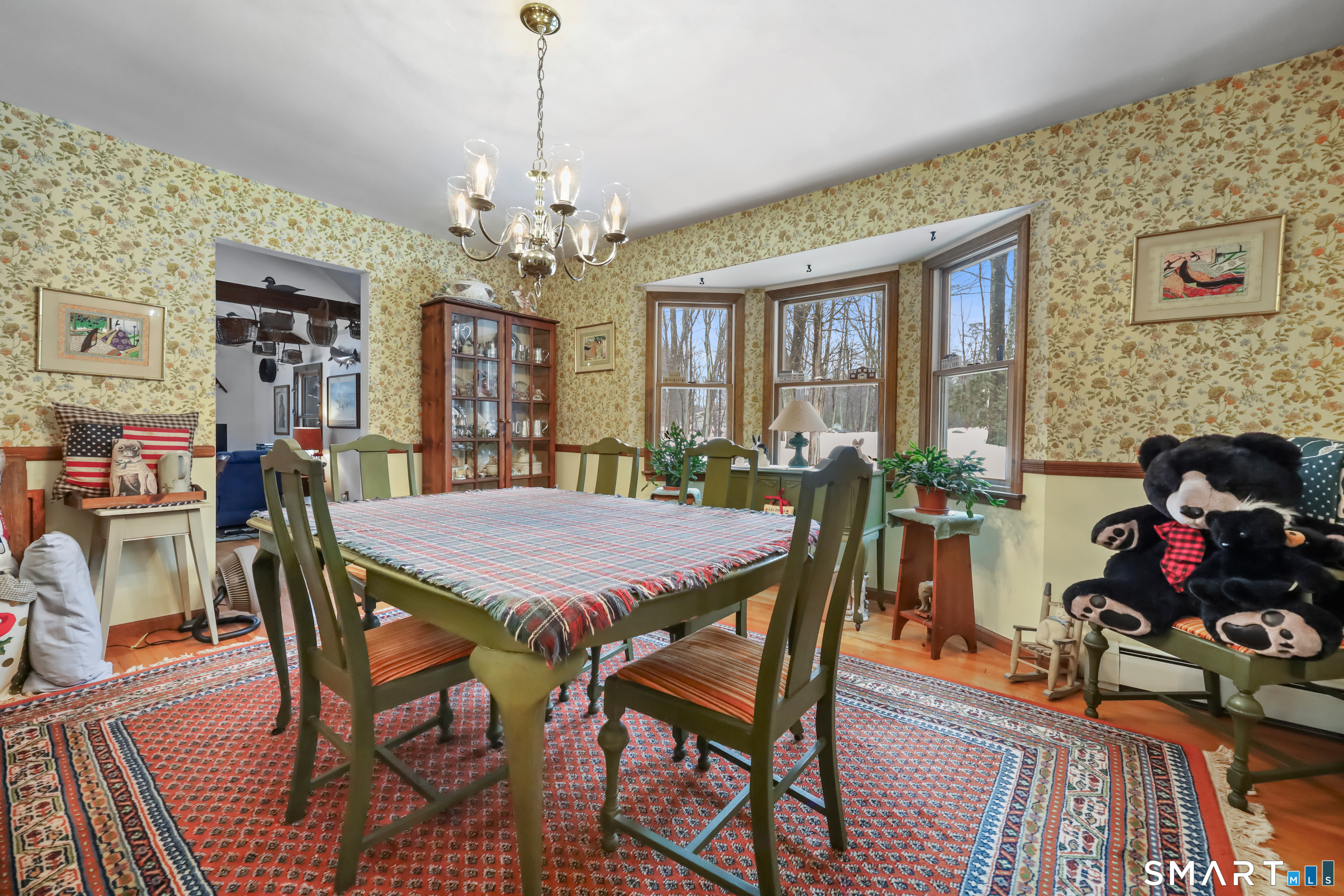 429 Rock House Road Redding, CT 06896 - Photo 6 of 26 a view of a dining room with furniture window and wooden floor