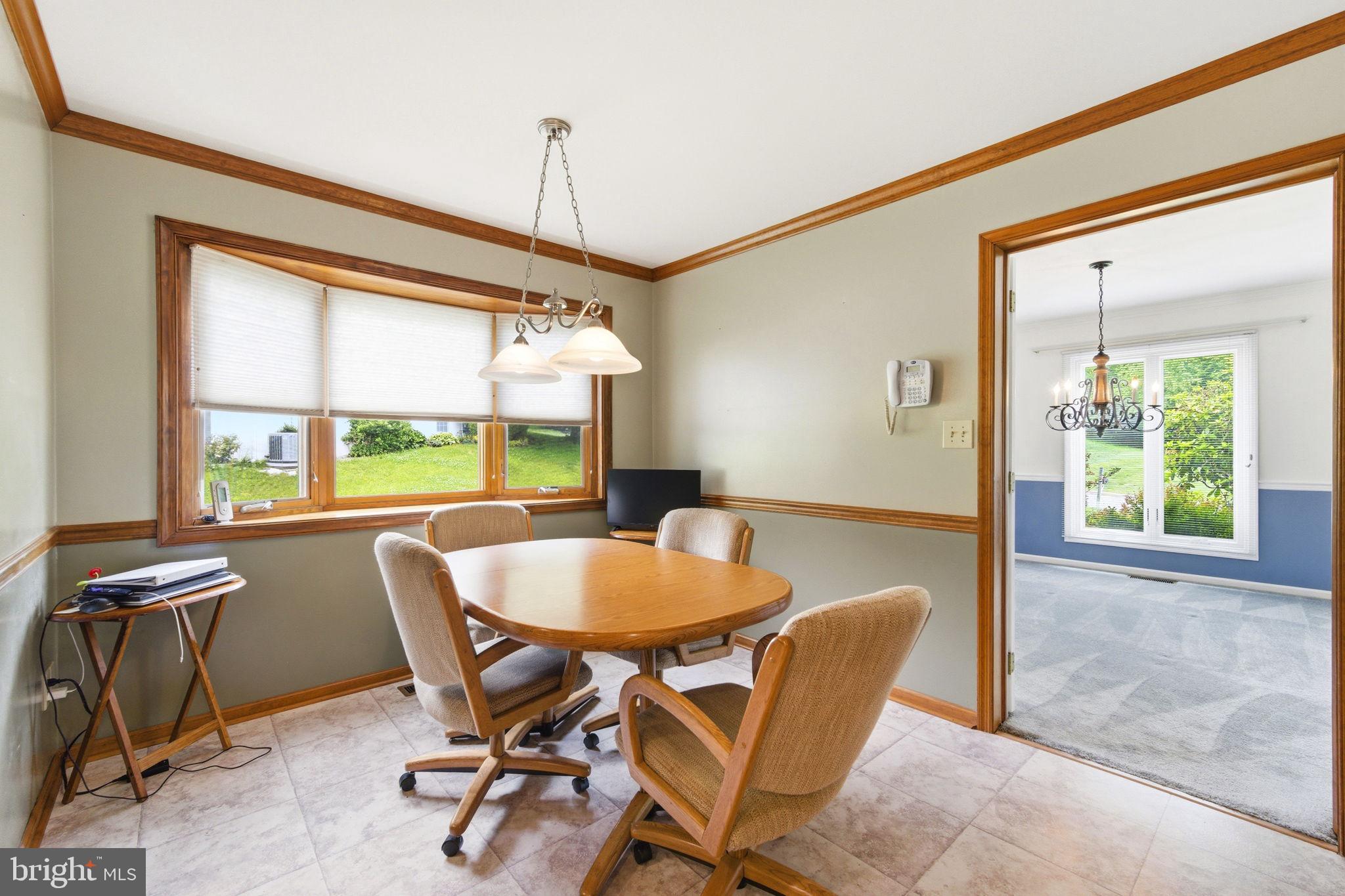 736 Letitia Drive Hockessin, DE 19707 - Photo 35 of 92 a view of a dining room with furniture window and outside view