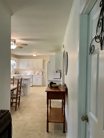 a view of a kitchen with table and chair