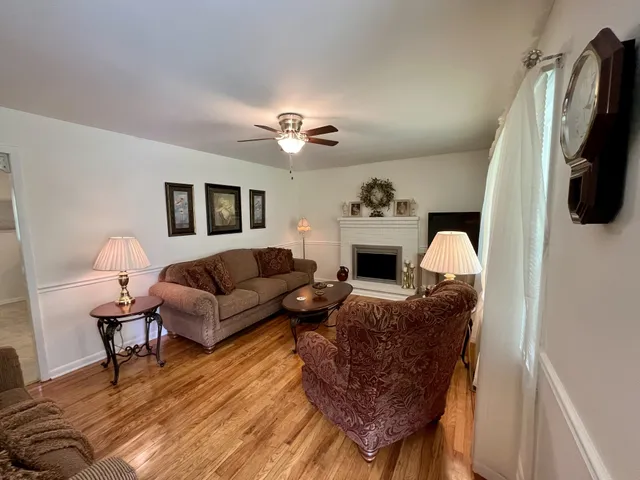 a living room with furniture fireplace and a flat screen tv