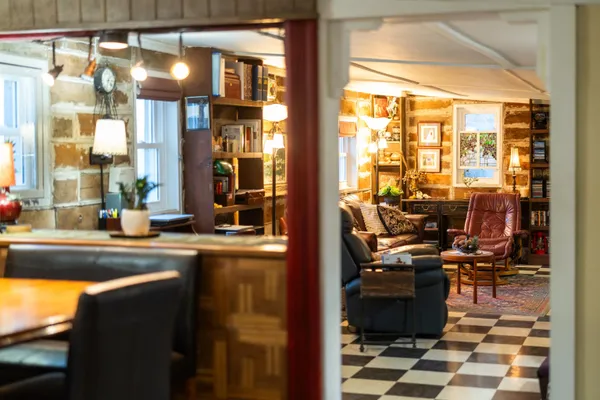 a view of living room with furniture and a fireplace