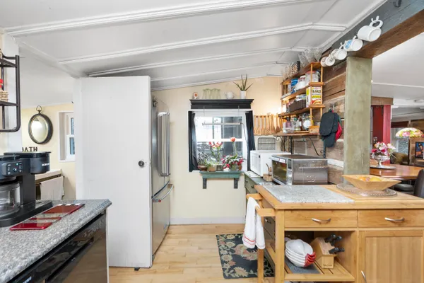a view of a bedroom with a bed and furniture