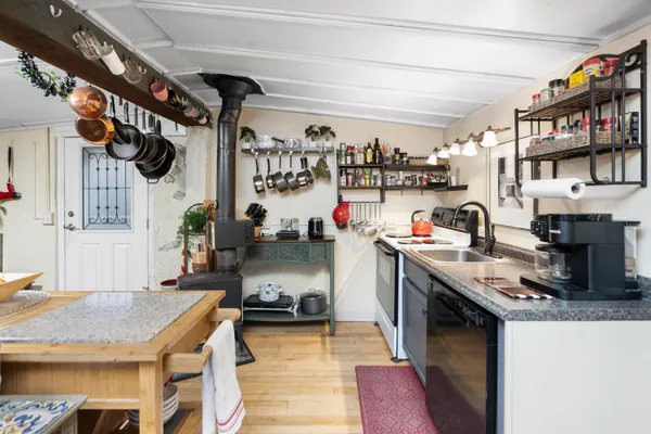 a bathroom with a double vanity sink mirror and shower