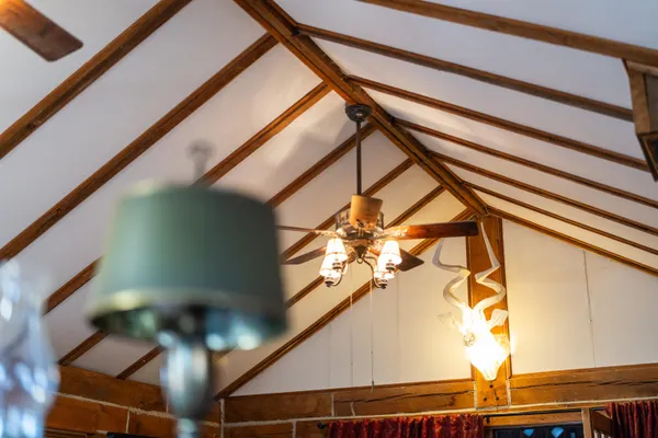 a view of a patio with a dining table and chairs with wooden floor