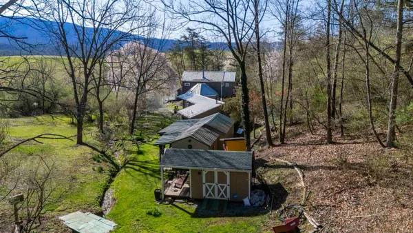 a view of a house with backyard
