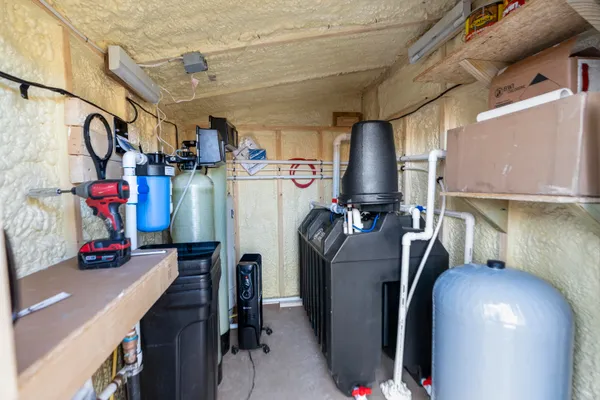 a view of a house with backyard garden and patio