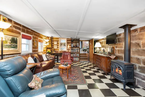 a living room with furniture and a rug