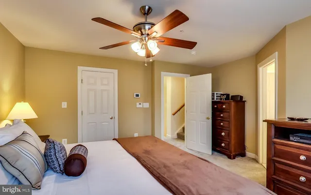 a bathroom with a bathtub a sink and a large mirror