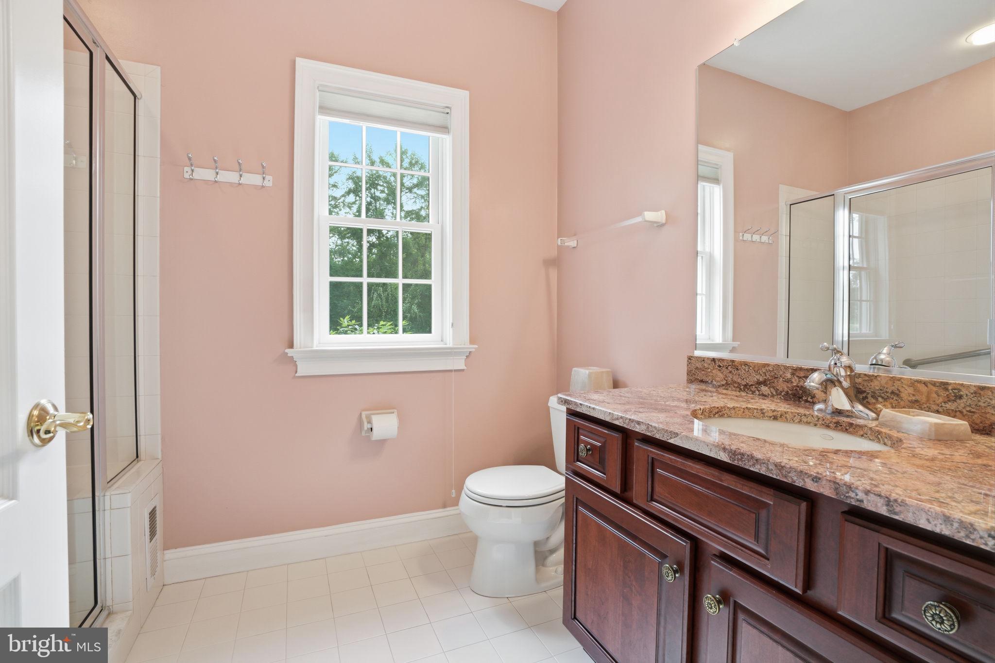 1588 Wrightstown Road Newtown, PA 18940 - Photo 48 of 81 a bathroom with a granite countertop sink a toilet and a mirror