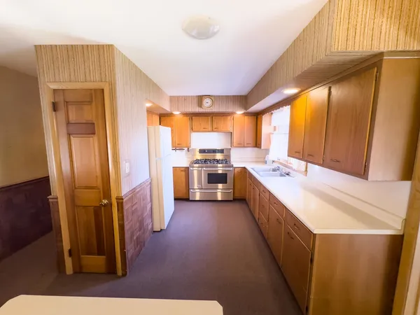 a large kitchen with a large window