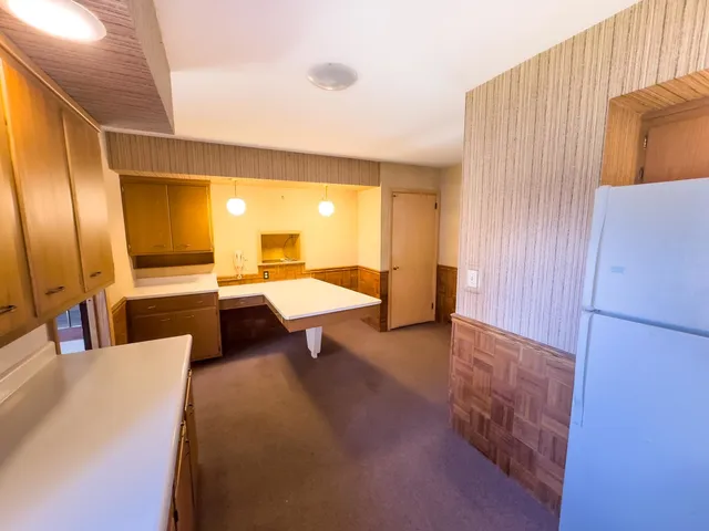 a lobby with furniture and a rug